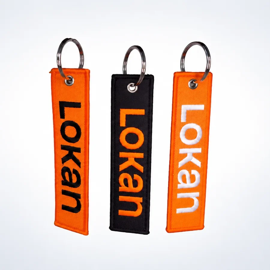 Trois porte-clés flamme Lokan orange et noir avec anneaux métalliques