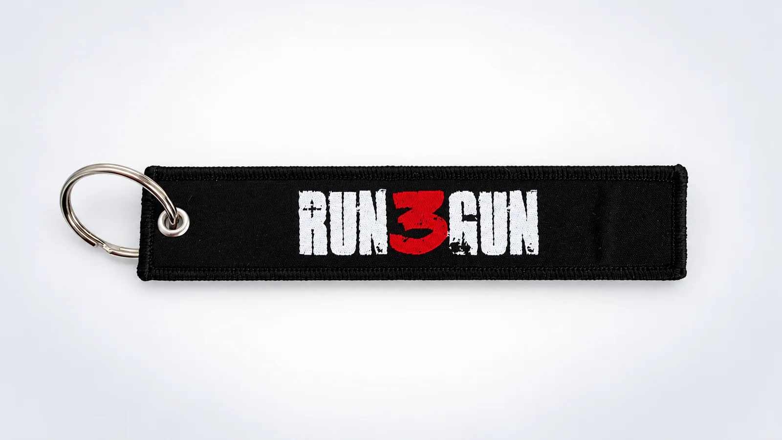 Porte-clés flamme tissé noir Run 3 Gun de Klaim avec anneau métallique